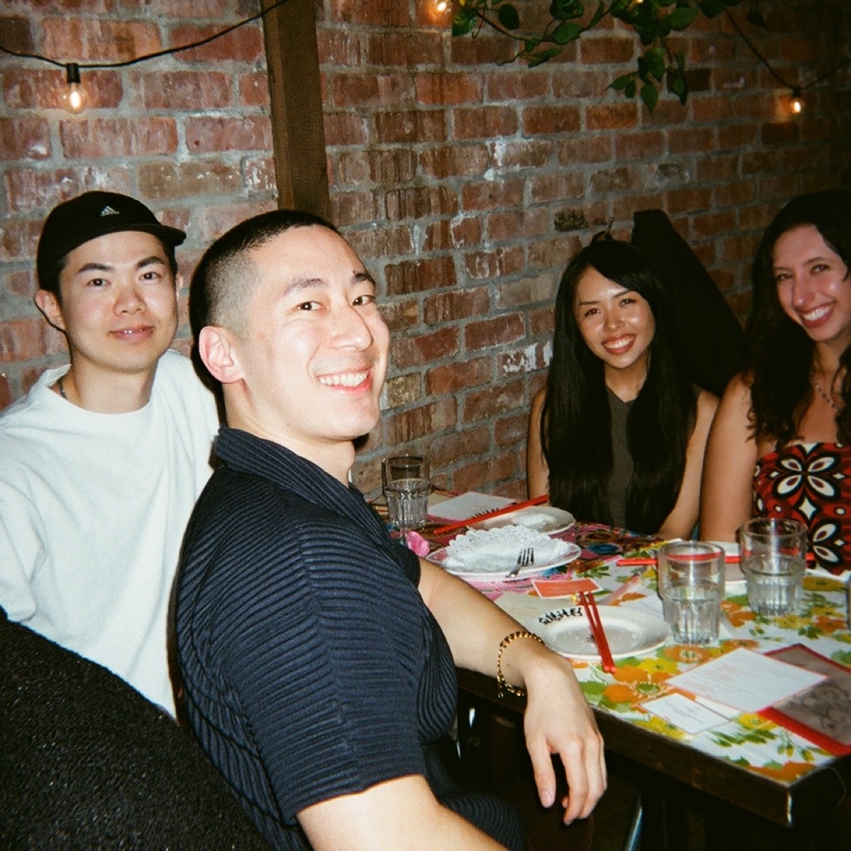 Guests smiling together at The Spiciest Supper Club
