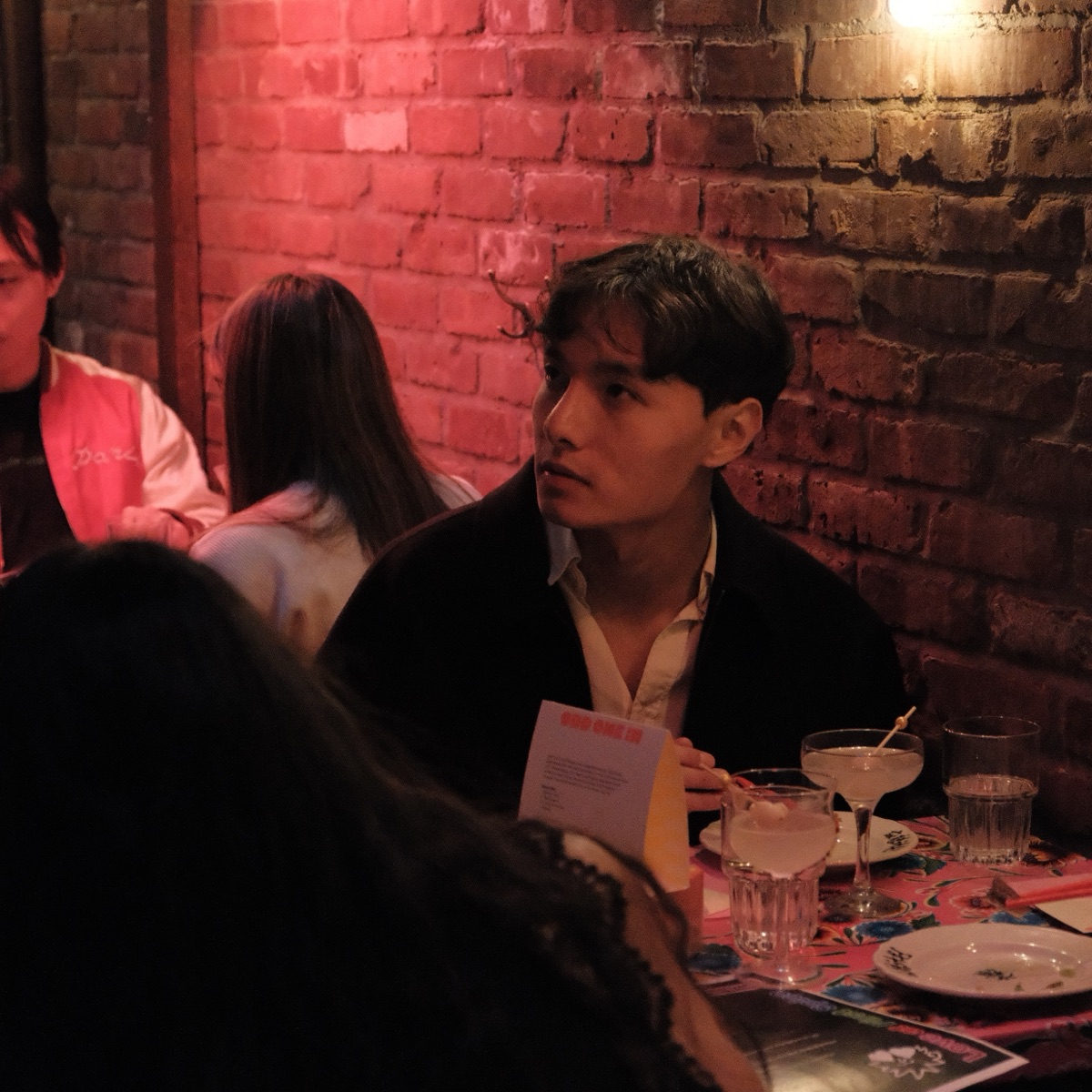A candid supper club table scene