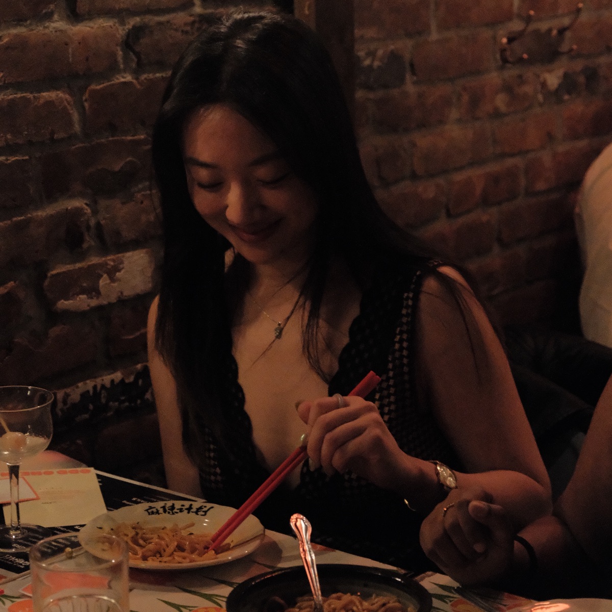 Guests chatting under warm red light