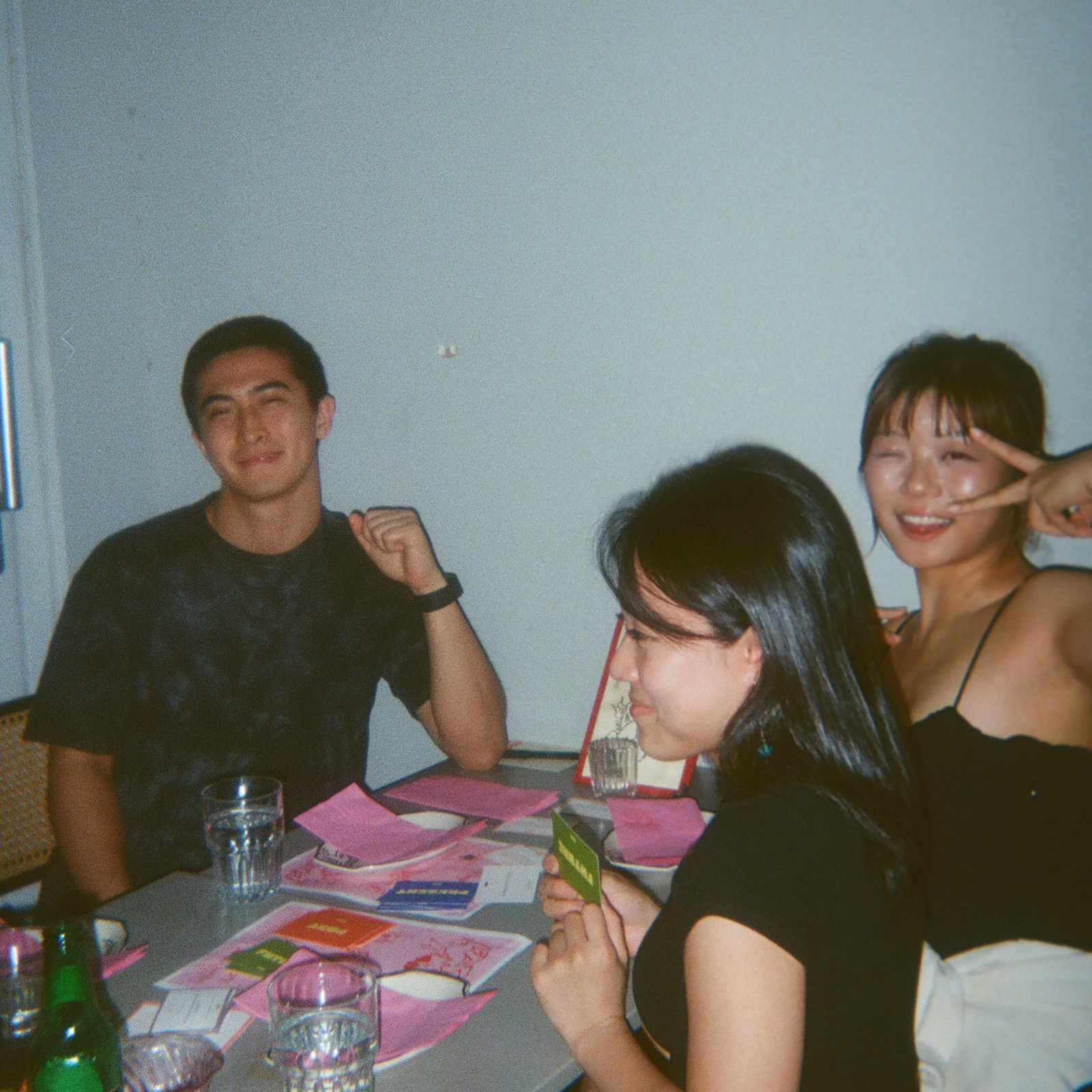 A crowded dinner table during a singles supper club